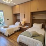 Modern children's bedroom set made of natural wood.